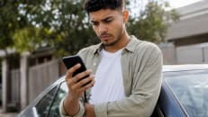 Person weighing whether an 84-month car loan is worth it.