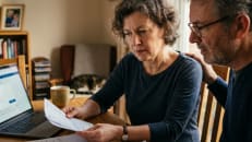 A family trying to sort out an online bank account after the death of a family member.