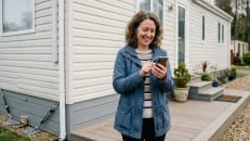 Homeowner reviewing mobile home insurance options.