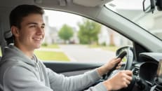 A teen driver driving his car with car insurance.