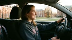 A college student driving her car under her parents' shared policy. 