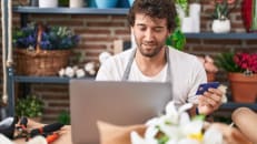 A business owner learning about whether credit card interest is tax deductible for his business.