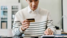 A man worried about his late payments for his credit cards. 