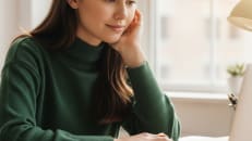 A woman learning about debt consolidation vs. balance transfer cards. 