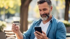 A man learning about hacks to turn his everyday spending into cash back rewards. 