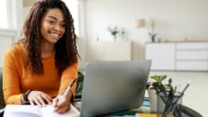 A first-time home buyer making a checklist. 