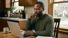 Homeowner reviewing rising home insurance costs and renewal bill.