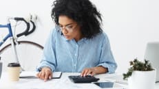 A woman figuring out how to get an SBA loan. 