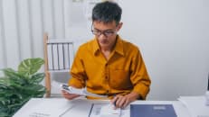 A man filing his income tax return. 