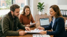 A couple talking to a mortgage lender about investment properties.