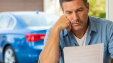 A man deciding whether he should get full coverage or liability car insurance.