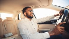 A man driving with one of the most expensive cars to repair. 