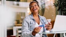 A woman learning about the benefits and drawbacks of online banking. 