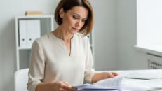 A woman organizing the documents she needs to apply for a personal loan. 