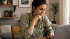 A woman considering a personal loan to borrow for her Summer travels.