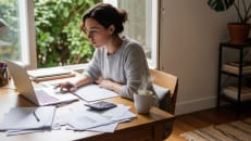 A self-employed, remote worker figuring out her tax. 