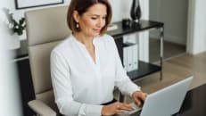 A woman learning how to lower her tax bill using standard deduction.