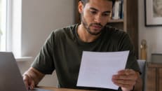 Person reviewing their student loan debt and repayment options.