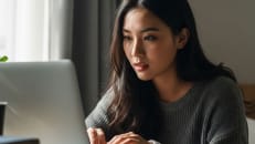 A woman learning about capital gains tax rates.
