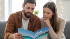 A couple wondering if they should take out a vacation loan to fund their holiday. 