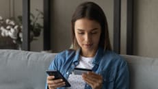 A woman learning the difference between a virtual wallet and online banking. 