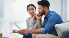 Young couple working on their budget