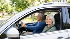 senior-couple-driving-safe-car