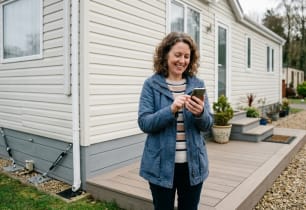 Homeowner reviewing mobile home insurance options.