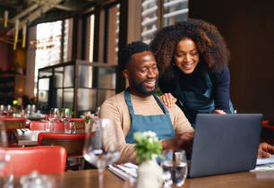 Small business owners opening their new separate business checking account. 