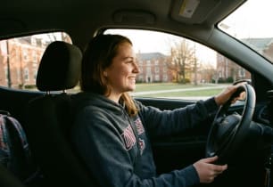 A college student driving her car under her parents' shared policy. 