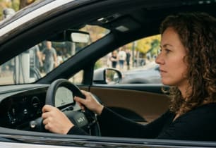 A woman considering getting new auto insurance.