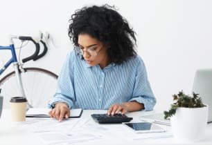 A woman figuring out how to get an SBA loan. 