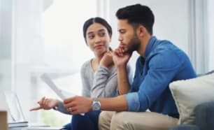 Young couple working on their budget