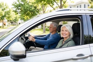 senior-couple-driving-safe-car
