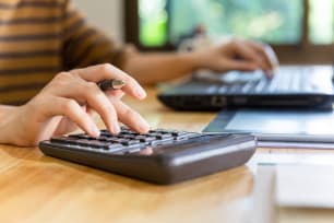 Checking Account Fees: 8 Common Fees & How to Avoid Them