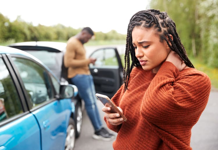A woman that just got into a car accident due to a car insurance scam. 
