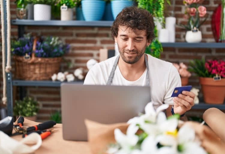A business owner learning about whether credit card interest is tax deductible for his business.