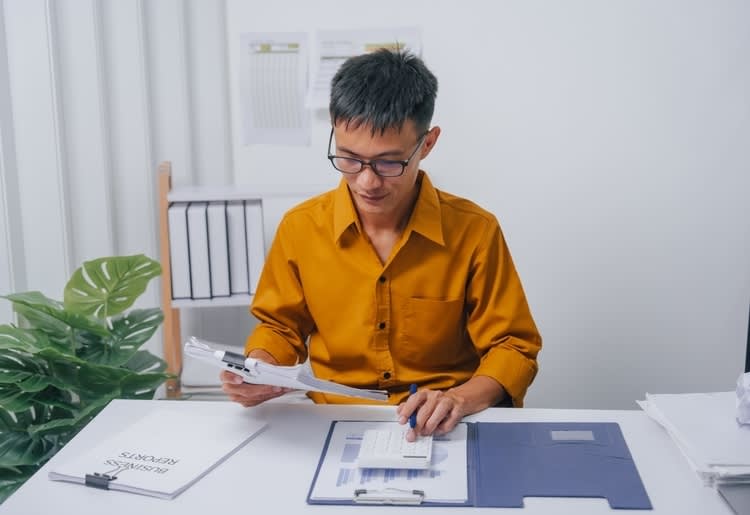 A man filing his income tax return. 