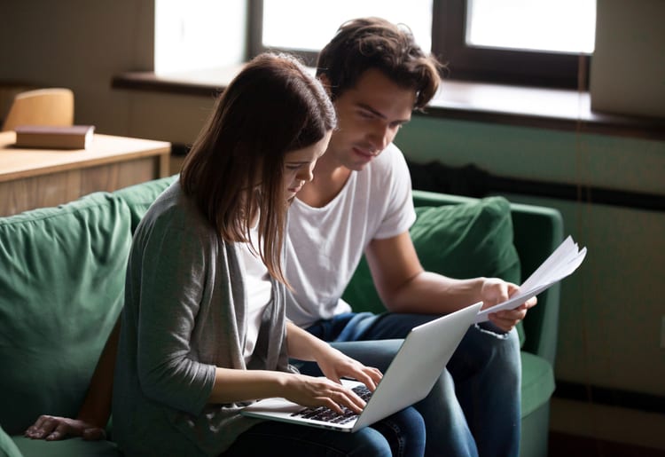 A man and woman learning about life insurance mistakes to avoid. 