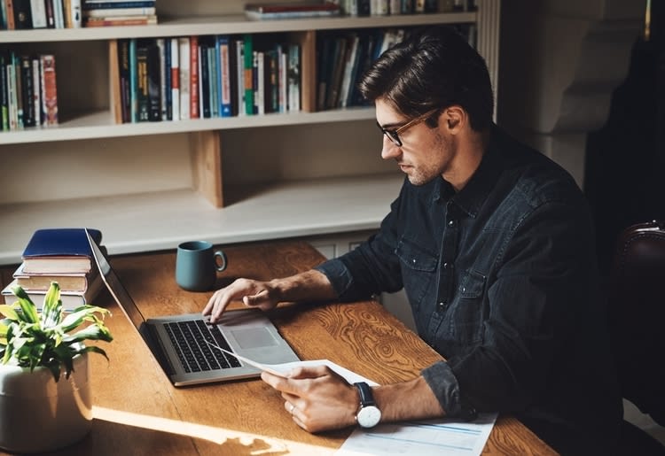 A remote worker learning about tax deductions and claiming expenses working from home.
