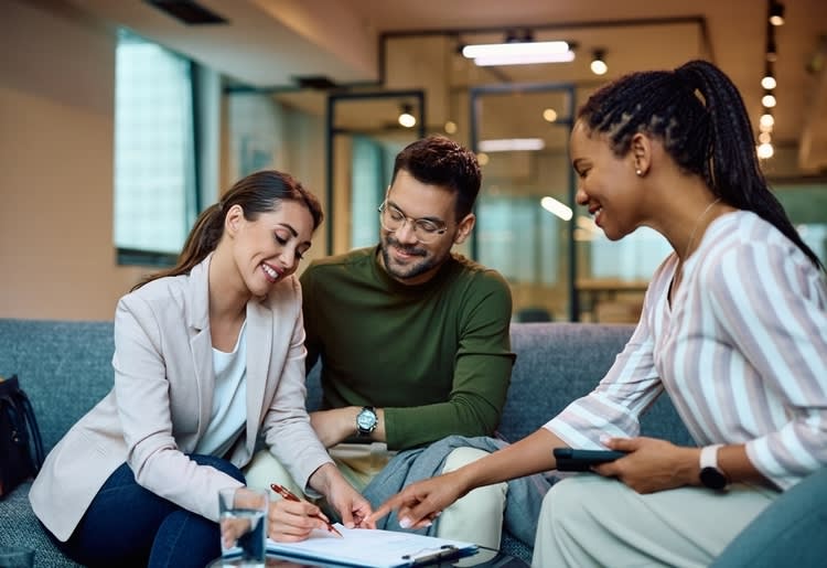 A couple learning about secured vs. unsecured debt consolidation loans. 